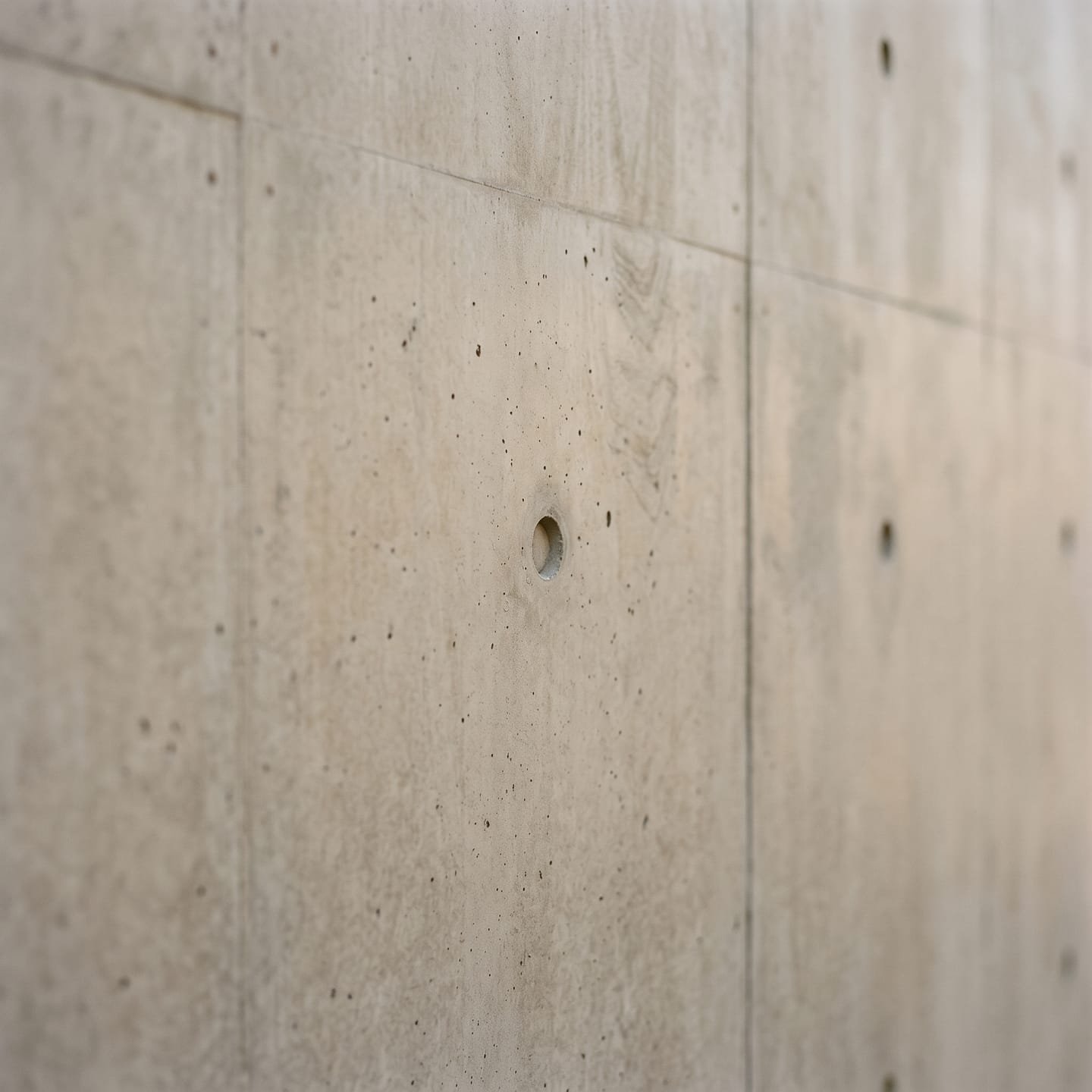 Board-marked concrete wall in soft light